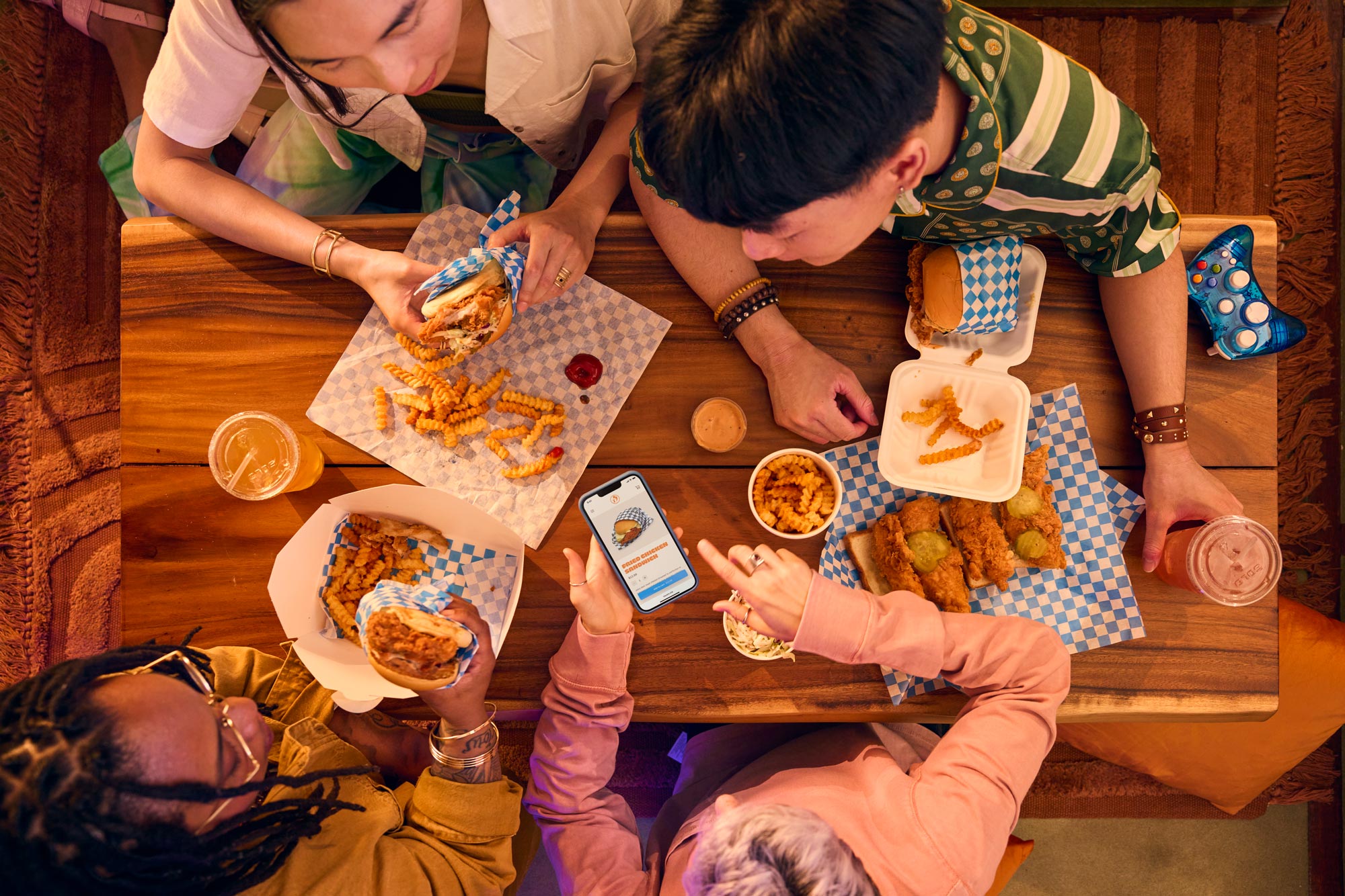 Top down photo of a group of people looking at a restaurant website